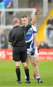 26 May 2013; Referee Cormac Reilly shows John O'Loughlin, Laois, a red card, near the end of the game. Leinster GAA Football Senior Championship, First Round, Laois v Louth, O'Moore Park, Portlaoise, Co. Laois. Picture credit: Dáire Brennan / SPORTSFILE