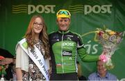 26 May 2013; Second across the line Nicholas Vereecken, An Post Chain Reaction, with Miss An Post Rás, Anna Otto, after Stage 8 of the 2013 An Post Rás. Naas - Skerries. Photo by Sportsfile