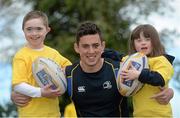 28 May 2013; Leinster Academy player Noel Reid with members of Bray Lakers Ross Brett, age 8, and Emma Lande, age 6, in attendance as Leinster Rugby announce community partnership with Bray Lakers. UCD, Belfield, Dublin. Picture credit: Brian Lawless / SPORTSFILE