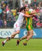 26 May 2013; Ryan Bradley, Donegal, is tackled by Sean Cavanagh, Tyrone. Ulster GAA Football Senior Championship, Quarter-Final, Donegal v Tyrone, MacCumhaill Park, Ballybofey, Co. Donegal. Picture credit: Ray McManus / SPORTSFILE