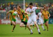 26 May 2013; Anthony Thompson, Donegal, in action against Conor Clarke, Tyrone. Ulster GAA Football Senior Championship, Quarter-Final, Donegal v Tyrone, MacCumhaill Park, Ballybofey, Co. Donegal. Picture credit: Ray McManus / SPORTSFILE