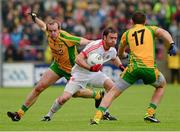 26 May 2013; Martin Penrose, Tyrone, in action against Neil Gallagher, left, and Declan Walsh, Donegal. Ulster GAA Football Senior Championship, Quarter-Final, Donegal v Tyrone, MacCumhaill Park, Ballybofey, Co. Donegal. Picture credit: Ray McManus / SPORTSFILE