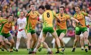 26 May 2013; Sean Cavanagh, Tyrone, is tackled by Donegal players Eamonn McGee, Rory Kavanagh and Leo McLoone. Ulster GAA Football Senior Championship, Quarter-Final, Donegal v Tyrone, MacCumhaill Park, Ballybofey, Co. Donegal. Picture credit: Ray McManus / SPORTSFILE