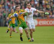 26 May 2013; Martin McElhinney, Donegal, in action against Justin McMahon, Tyrone. Ulster GAA Football Senior Championship, Quarter-Final, Donegal v Tyrone, MacCumhaill Park, Ballybofey, Co. Donegal. Picture credit: Oliver McVeigh / SPORTSFILE