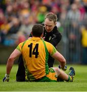 26 May 2013; The Donegal doctor, Kevin Moran, attends to captain, Michael Murphy, during the second half. Ulster GAA Football Senior Championship, Quarter-Final, Donegal v Tyrone, MacCumhaill Park, Ballybofey, Co. Donegal. Picture credit: Ray McManus / SPORTSFILE
