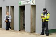 26 May 2013; A Garda reading the match programme as the Donegal supporters arrive. Ulster GAA Football Senior Championship, Quarter-Final, Donegal v Tyrone, MacCumhaill Park, Ballybofey, Co. Donegal. Picture credit: Oliver McVeigh / SPORTSFILE
