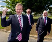 29 May 2013; An Taoiseach Enda Kenny T.D. officially opened the Irish Sport HQ at the National Sports Campus in Blanchardstown. He was accompanied by Minister for Transport, Tourism and Sport, Leo Varadkar T.D. who has responsibility for the development of the National Sports Campus. With An Taoiseach, as he arrives for the opening, are Sean Benton, Chairman NSCDA, and Barry O'Brien, right, CEO NSCDA. The 19 National Governing Bodies (NGBs) of Sport which have moved into the new Irish Sport HQ are, Angling Council of Ireland, Badminton Ireland, Canoeing Ireland, Cerebral Palsy Sport Ireland, Federation of Irish Sport, Gaelic Athletic Association, Gymnastics Ireland, Irish Ice Hockey Association, Irish Judo Association, Irish Olympic Handball Association, Irish Sports Council / Coaching Ireland, Irish Squash, Mountaineering Ireland, Paralympics Ireland, Pitch and Pitt Union of Ireland, Student Sport Ireland, Swim Ireland, Table Tennis Ireland and The Camogie Association. Official Opening of Irish Sport HQ, National Sports Campus, Blanchardstown, Dublin. Picture credit: Ray McManus / SPORTSFILE