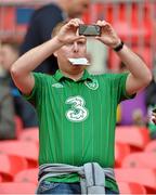 29 May 2013; A Republic of Ireland supporter takes a picture of the stadium on his mobile phone before the game. Friendly International, England v Republic of Ireland, Wembley Stadium, London, England. Picture credit: Barry Cregg / SPORTSFILE