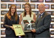 30 May 2013; Clare Timoney, Antrim, is presented her certificate by Lynn Moynihan, left, Local Marketing Manager, TESCO Ireland, and Pat Quill, President of the Ladies Football Association, after being selected on the Tesco HomeGrown NFL Division 4 team of the year. 2013 TESCO HomeGrown Ladies National Football Team of the League Presentations. Croke Park, Dublin. Picture credit: Barry Cregg / SPORTSFILE