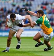 1 June 2013; John Doyle, Kildare, is tackled by Paul McConway, Offaly. Leinster GAA Football Senior Championship, Quarter-Final, Offaly v Kildare, Croke Park, Dublin. Picture credit: Ray McManus / SPORTSFILE
