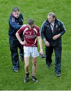 1 June 2013; Kevin Maguire, Westmeath, alongside manager Pat Flanagan, right, gets a pat on the back from selector Tom D'Arcy after defeat to Dublin. Leinster GAA Football Senior Championship, Quarter-Final, Dublin v Westmeath, Croke Park, Dublin. Picture credit: Diarmuid Greene / SPORTSFILE