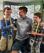 3 June 2013; Republic of Ireland player Sean St. Ledger faced tough questions from Maurice Quinn, left, age 9, and Matthew, age 7, at Three's 'Kid Conference' ahead of the Republic of Ireland v Faroe Islands World Cup qualifier on Friday. To see Three's 'Kids Press Conference'  video visitwww.facebook.com/3Ireland. Portmarnock Hotel & Golf Links, Portmarnock, Co. Dublin. Picture credit: David Maher / SPORTSFILE