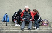 2 June 2013; Down supporters Malachy Sharvin, Kelief, Co Down, and his grand Children, 14 year old Eamon O'Hare and 11 year old Eimear Breen, reading the programme. Ulster GAA Football Senior Championship, Quarter-Final, Derry v Down, Celtic Park, Derry. Picture credit: Oliver McVeigh / SPORTSFILE