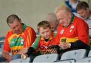 2 June 2013; Eight year old Charlie McSteen, from Bagenalstown, Co. Carlow, with his grandfather Brian and father Cathal McSteen at the game. Leinster GAA Hurling Senior Championship, Quarter-Final, Laois v Carlow, O'Moore Park, Portlaoise, Co. Laois. Picture credit: Matt Browne / SPORTSFILE