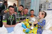 3 June 2013; FAI Junior cup winners Sheriff YC players, from left, brothers Lee and Stephen Murphy, Ollie Smith and Paul Murphy, with Joseph Davis, age 4, from Westmeath, on a visit to Temple Street Children's Hospital. Temple Street Children's Hospital, Temple Street, Dublin. Picture credit: Ray Lohan / SPORTSFILE