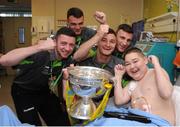 3 June 2013; FAI Junior cup winners Sheriff YC players, from left, Séan Murphy, brothers Lee, Paul and Stephen Murphy with Jake Naughton, 14, from Wexford, on a visit to Temple Street Children's Hospital. Temple Street Children's Hospital, Temple Street, Dublin. Picture credit: Ray Lohan / SPORTSFILE