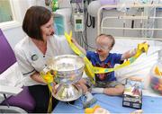 3 June 2013; FAI Junior cup winners Sheriff YC visited Temple Street Children's Hospital. Pictured with the cup is Nurse Ann Tierney and Anthony Iannucci, age 6, from Sallynoggin, Dublin. Temple Street Children's Hospital, Temple Street, Dublin. Picture credit: Ray Lohan / SPORTSFILE
