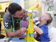 3 June 2013; FAI Junior cup winner Sheriff YC goalkeeper Lee Murphy with Anthony Iannucci, age 6, from Sallynoggin, Dublin, on a visit to Temple Street Children's Hospital. Temple Street Children's Hospital, Temple Street, Dublin. Picture credit: Ray Lohan / SPORTSFILE