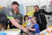 3 June 2013; FAI Junior cup winners Sheriff YC goalkeeper Lee Murphy shows Anthony Iannucci, age 6, from Sallynoggin, Dublin, the cup in the company of Anthony's mother Janice and Sheriff YC's Ollie Smith and chairman Brian Dunleavy, right, during a visit to Temple Street Children's Hospital. Temple Street Children's Hospital, Temple Street, Dublin. Picture credit: Ray Lohan / SPORTSFILE