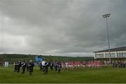 12 May 2013; The Cork and Tipperary teams walk in the pre-match parade before the game. Official Opening of New Cloughduv GAA Complex, Cork v Tipperary, Fr.O'Driscoll Park, Cloughduv, Co. Cork. Picture credit: Brendan Moran / SPORTSFILE