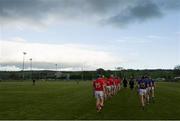 12 May 2013; The Cork and Tipperary teams walk in the pre-match parade before the game. Official Opening of New Cloughduv GAA Complex, Cork v Tipperary, Fr.O'Driscoll Park, Cloughduv, Co. Cork. Picture credit: Brendan Moran / SPORTSFILE