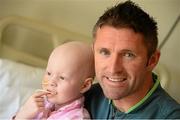 5 June 2013; Republic of Ireland's Robbie Keane with Katie McLaughlin, age 3, from Redcastle, Co. Donegal, during a visit to Our Lady's Children's Hospital. Our Lady's Children's Hospital, Crumlin, Dublin. Picture credit: David Maher / SPORTSFILE