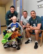 5 June 2013; Republic of Ireland's Robbie Keane, Richard Dunne and Jonathan Walters with Brian Plummer, age 7, from Tallaght, Dublin, during a visit to Our Lady's Children's Hospital. Our Lady's Children's Hospital, Crumlin, Dublin. Picture credit: David Maher / SPORTSFILE