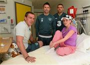 5 June 2013; Republic of Ireland's Richard Dunne, Robbie Keane and Jonathan Walters with Ciara Moran, age 16, from Athlone, Co. Westmeath, during a visit to Our Lady's Children's Hospital. Our Lady's Children's Hospital, Crumlin, Dublin. Picture credit: David Maher / SPORTSFILE