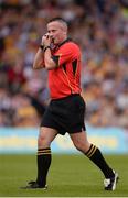 2 June 2013; Referee James McGrath adjusts his ear piece during the game. Munster GAA Hurling Senior Championship, Quarter-Final, Clare v Waterford, Semple Stadium, Thurles, Co. Tipperary. Picture credit: Ray McManus / SPORTSFILE
