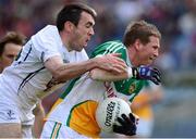 1 June 2013; Brian Darby, Offaly, is tackled by John Doyle, Kildare. Leinster GAA Football Senior Championship Quarter-Final, Offaly v Kildare, Croke Park, Dublin. Picture credit: Ray McManus / SPORTSFILE