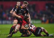 3 November 2017; Ian Keatley of Munster is tackled by Aaron Wainwright, left and Ashton Hewitt of Dragons during the Guinness PRO14 Round 8 match between Munster and Dragons at Irish Independent Park in Cork. Photo by Eóin Noonan/Sportsfile