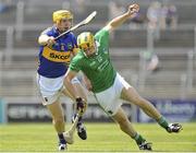 9 June 2013; Dan Morrissey, Limerick, in action against David Young, Tipperary. Munster GAA Hurling Intermediate Championship Semi-Final, Limerick v Tipperary, Gaelic Grounds, Limerick. Picture credit: Pat Murphy / SPORTSFILE