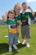 9 June 2013; Offaly supporters Lochlann Fletcher, age 2, left, with his sister and brother, Cayla, age 9, and Odhran, age 5, from Tullamore, Co. Offaly. Leinster GAA Hurling Senior Championship Quarter-Final, Offaly v Kilkenny, O'Connor Park, Tullamore, Co. Offaly. Picture credit: Brian Lawless / SPORTSFILE