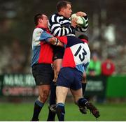 22 January 2000; Emmet Farrell, Blackrock, is tackled by Richie Stephens (13) and Simon Best, Belfast Harlequinns, A.I.B League Divison 2, Blackrock v Belfast Harlequinns, Stradbrook, Dublin. Rugby. Picture credit; Damien Eagers/SPORTSFILE