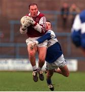 23 January 2000; Ger Heavin, Westmeath in action against Stephen Kelly, Laois, O'Byrne Cup Football Semi Final, O'Moore Park, Portlaoise. Picture credit; Damien Eagers/SPORTSFILE
