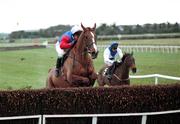 26 February 2000;  His Song, Adrian Maguire, leads Danoli over the final fence in the Brophy Farrell Auctioneers Newlands Steeplechase at Naas. Horse racing. Picture credit; SPORTSFILE