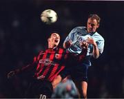 11 February 2000; Shelbourne's Tony McCarthy heads clear of  Bohemian's Ray Kelly. Bohemians v Shelbourne, eircom League, Dalymount Park. Soccer. Picture credit;David Maher/SPORTSFILE