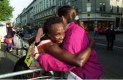 25 October 1999; Kenya's Esther Kiplagat celebrates with a fan after winning The Women's 1999 98FM Dublin City Marathon, O'Connell Street, Dublin. Athletics. Picture credit; Ray Lohan/SPORTSFILE