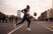 25 October 1999; Kenya's John Mutai on his way across O'Connell Bridge at the start of The 1999 98FM Dublin City Marathon, O'Connell Street, Dublin. Athletics. Picture credit; Ray Lohan/SPORTSFILE