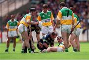 25 July 1999; The Offaly team doctor attends to Hubert Rigney before he was carried off with an injury. Clare v Galway, All Ireland Hurling Quarter Final, Croke Park, Dublin. Picture credit; Ray McManus/SPORTSFILE