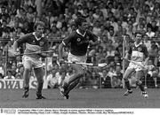 2 September 1984; Cork's Jimmy Barry Murphy in action against Offaly's Eugene Coughlan. All-Ireland Hurling Final, Cork v Offaly, Semple Stadium, Thurles. Picture credit; Ray McManus/SPORTSFILE