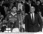 2 September 1984; Cork Captain John Fenton holds the Liam MacCarthy Cup also pictured is GAA President Paddy Buggy. All-Ireland Hurling Final, Cork v Offaly, Semple Stadium, Thurles. Picture credit; Ray McManus/SPORTSFILE