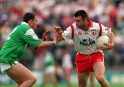 27 June 1999; Matt McGleenan, Tyrone, in action against Paul Courtney, Fermanagh. Tyrone v Fermanagh, Ulster Senior Football Championship, St. Tiernan's Park, Clones, Monaghan. Picture credit; David Maher/SPORTSFILE
