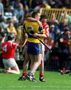 4 July 1999; Cork's Michael O'Connell and Clare's Colin Lynch pictured after the final whistle. Cork v Clare, Munster Senior Hurling Final, Semple Stadium, Thurles. Picture credit; Brendan Moran/SPORTSFILE