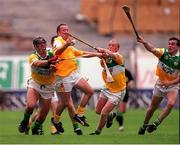25 July 1999; Antrim's Gary O'Kane is tackled by Offaly's Gary Hannify, John Troy and Johnny Pilkington. Offaly v Antrim, All Ireland Hurling Championship Quarter Finals, Croke Park, Dublin. Picture credit; Ray McManus/SPORTSFILE
