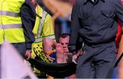 4 July 1999; Clare's Ollie Baker is stretchered off with an ankle injury. Cork v Clare, Munster Hurling Final, Semple Stadium, Thurles. Picture credit; Brendan Moran/SPORTSFILE