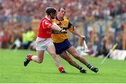 4 July 1999; Ollie Baker, Clare in action against Wayne Sherlock, Cork, Munster Hurling Final, Semple Stadium. Picture credit; Damien Eagers/SPORTSFILE