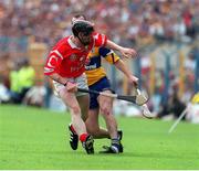 4 July 1999; Ollie Baker, Clare turns on his ankle which led him to be substituted, also pictured is Wayne Sherlock, Cork, Munster Hurling Final, Semple Stadium. Picture credit; Damien Eagers/SPORTSFILE