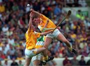 25 July 1999; Antrim pair Ronan Donnelly (right) and Gary O'Kane in action against Johnny Pilkington, Offaly, Offaly v Antrim, All Ireland Hurling Quarter Final, Croke Park. Picture credit; Damien Eagers/SPORTSFILE