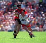 11 July 1999; Ronan McGarrity, Tyrone in action against Shane Mulholland, Down, Ulster Football Championship Semi Final, Casement Park. Picture Credit; Damien Eagers/SPORTSFILE